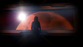 Astronaut at the porthole of a spaceship approaching Mars. photo