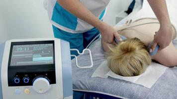 Using electromagnetic super inductive system to recover from shoulder injuries. Going to SIS therapies for muscle relaxation. Recovery from trauma and rheumatic pathologies in a physiotherapy clinic video