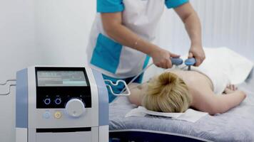 Using electromagnetic super inductive system to recover from shoulder injuries. Going to SIS therapies for muscle relaxation. Recovery from trauma and rheumatic pathologies in a physiotherapy clinic. video