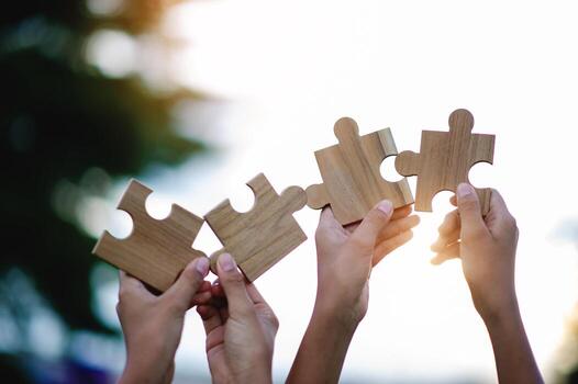 Jigsaw puzzle of unity, cooperation among groups, teamwork, team connection and support photo