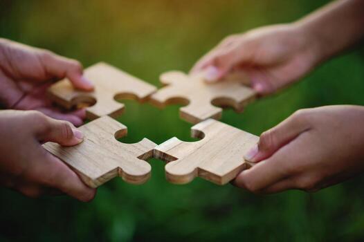 Jigsaw puzzle of unity, cooperation among groups, teamwork, team connection and support photo