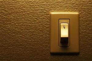 Installing a dimmer switch on a textured wall in a modern interior setting. photo