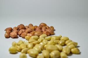 Fried peanuts. Served in a transparent jar. Selective focus photo