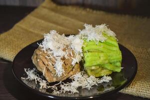 Textured, made from processed cassava that is steamed and mashed. Served with grated coconut. photo
