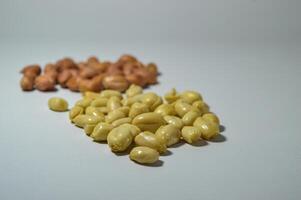 Fried peanuts. Served in a transparent jar. Selective focus photo