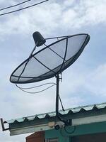 satellite dish on roof of house photo