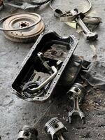 broken engine parts on the ground photo