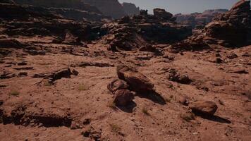 Some rocks and dirt in the middle of a desert video