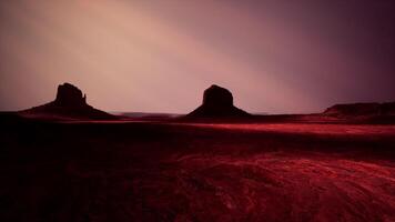 Two large rocks in the middle of a desert video