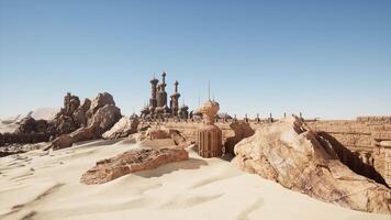 A desert scene with rocks and buildings in the background video