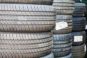 Stack of Used Car Tires at a Garage photo