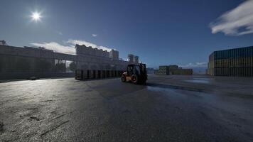 Forklift Operating in a Sunlit Shipping Yard at Dawn video