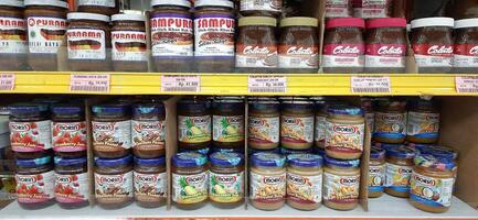 Coang supermarket shelf display. One of the complete cake and food equipment and ingredients stores in Makassar. South Sulawesi, Indonesia - August 7 2024 photo