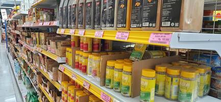 Coang supermarket shelf display. One of the complete cake and food equipment and ingredients stores in Makassar. South Sulawesi, Indonesia - August 7 2024 photo