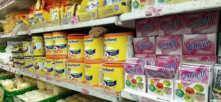 Coang supermarket shelf display. One of the complete cake and food equipment and ingredients stores in Makassar. South Sulawesi, Indonesia - August 7 2024 photo