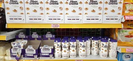 Coang supermarket shelf display. One of the complete cake and food equipment and ingredients stores in Makassar. South Sulawesi, Indonesia - August 7 2024 photo