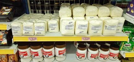 Coang supermarket shelf display. One of the complete cake and food equipment and ingredients stores in Makassar. South Sulawesi, Indonesia - August 7 2024 photo