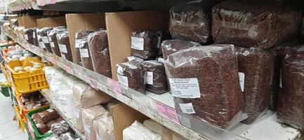 Coang supermarket shelf display. One of the complete cake and food equipment and ingredients stores in Makassar. South Sulawesi, Indonesia - August 7 2024 photo