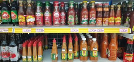 Coang supermarket shelf display. One of the complete cake and food equipment and ingredients stores in Makassar. South Sulawesi, Indonesia - August 7 2024 photo