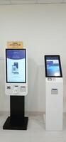 Modern self check in machine for patient registration in hospitals. Makassar, South Sulawesi, Indonesia - August 12 2024 photo