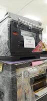 Coang supermarket shelf display. One of the complete cake and food equipment and ingredients stores in Makassar. South Sulawesi, Indonesia - August 7 2024 photo