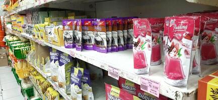 Coang supermarket shelf display. One of the complete cake and food equipment and ingredients stores in Makassar. South Sulawesi, Indonesia - August 7 2024 photo
