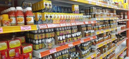 Coang supermarket shelf display. One of the complete cake and food equipment and ingredients stores in Makassar. South Sulawesi, Indonesia - August 7 2024 photo