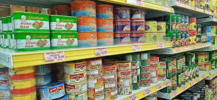 Coang supermarket shelf display. One of the complete cake and food equipment and ingredients stores in Makassar. South Sulawesi, Indonesia - August 7 2024 photo