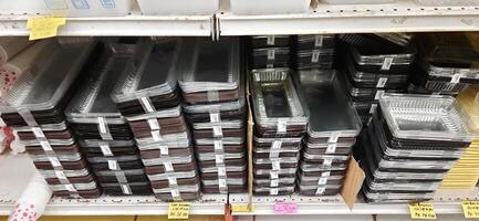 Coang supermarket shelf display. One of the complete cake and food equipment and ingredients stores in Makassar. South Sulawesi, Indonesia - August 7 2024 photo