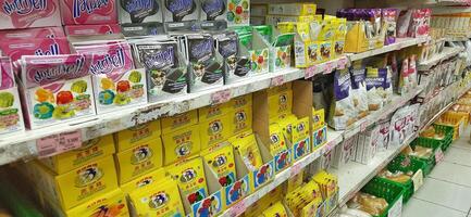 Coang supermarket shelf display. One of the complete cake and food equipment and ingredients stores in Makassar. South Sulawesi, Indonesia - August 7 2024 photo