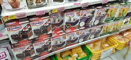 Coang supermarket shelf display. One of the complete cake and food equipment and ingredients stores in Makassar. South Sulawesi, Indonesia - August 7 2024 photo