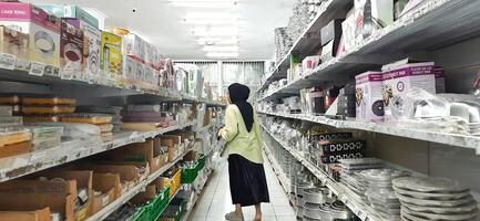 Coang supermarket shelf display. One of the complete cake and food equipment and ingredients stores in Makassar. South Sulawesi, Indonesia - August 7 2024 photo