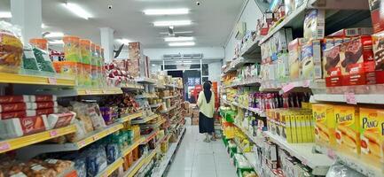 Coang supermarket shelf display. One of the complete cake and food equipment and ingredients stores in Makassar. South Sulawesi, Indonesia - August 7 2024 photo