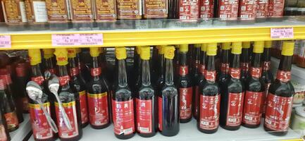 Coang supermarket shelf display. One of the complete cake and food equipment and ingredients stores in Makassar. South Sulawesi, Indonesia - August 7 2024 photo