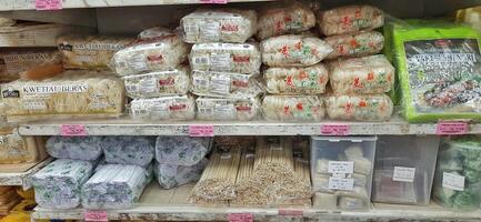 Coang supermarket shelf display. One of the complete cake and food equipment and ingredients stores in Makassar. South Sulawesi, Indonesia - August 7 2024 photo