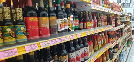 Coang supermarket shelf display. One of the complete cake and food equipment and ingredients stores in Makassar. South Sulawesi, Indonesia - August 7 2024 photo