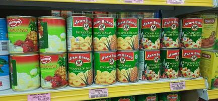 Coang supermarket shelf display. One of the complete cake and food equipment and ingredients stores in Makassar. South Sulawesi, Indonesia - August 7 2024 photo