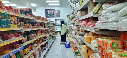 Coang supermarket shelf display. One of the complete cake and food equipment and ingredients stores in Makassar. South Sulawesi, Indonesia - August 7 2024 photo