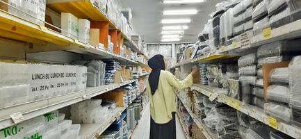 Coang supermarket shelf display. One of the complete cake and food equipment and ingredients stores in Makassar. South Sulawesi, Indonesia - August 7 2024 photo