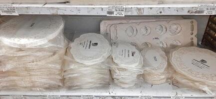 Coang supermarket shelf display. One of the complete cake and food equipment and ingredients stores in Makassar. South Sulawesi, Indonesia - August 7 2024 photo
