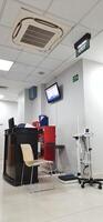 Atmosphere of patient queues to receive medical services at waiting area hospital. Makassar, South Sulawesi, Indonesia - August 12 2024 photo