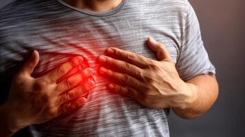 Closeup of man suffering from chest pain, heart attack or other health problem concept photo