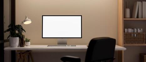 Front view of a computer desk in a contemporary room, a computer mockup on a table against the wall. photo