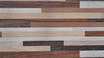 A wood grain patterned background with a variety of wood grain patterns. The background is a mix of different wood grain patterns, creating a visually interesting and diverse look photo