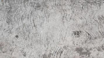 Attractive modern raw and uneven concrete wall surface - handmade gray texture with visible natural traces, texture and mortar structure photo