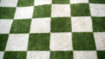 Green checkered tablecloth as a background. photo