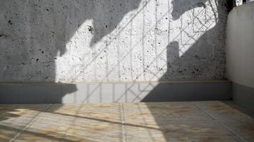 Ceramic floor with white concrete walls in the morning, for product display or montage. photo