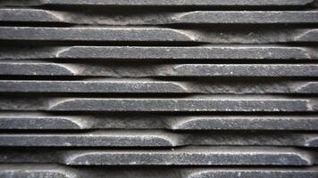 Black stone wall cement background for design. Industrial pattern. photo
