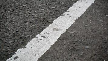 White line on the asphalt road. Abstract background and texture for design. photo