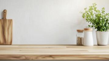 A serene kitchen countertop displaying natural wood, jars, and a potted plant, ideal for culinary and interior design themes. photo